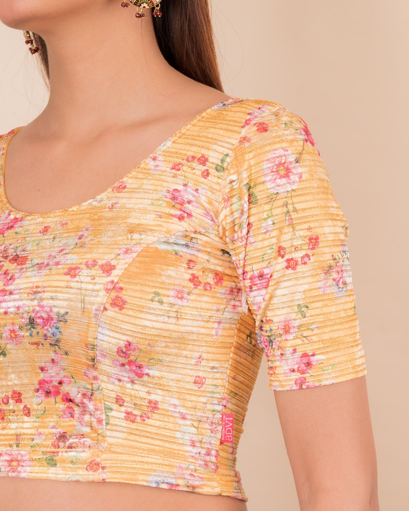 Close-up of the velvet fabric detailing the floral print texture.