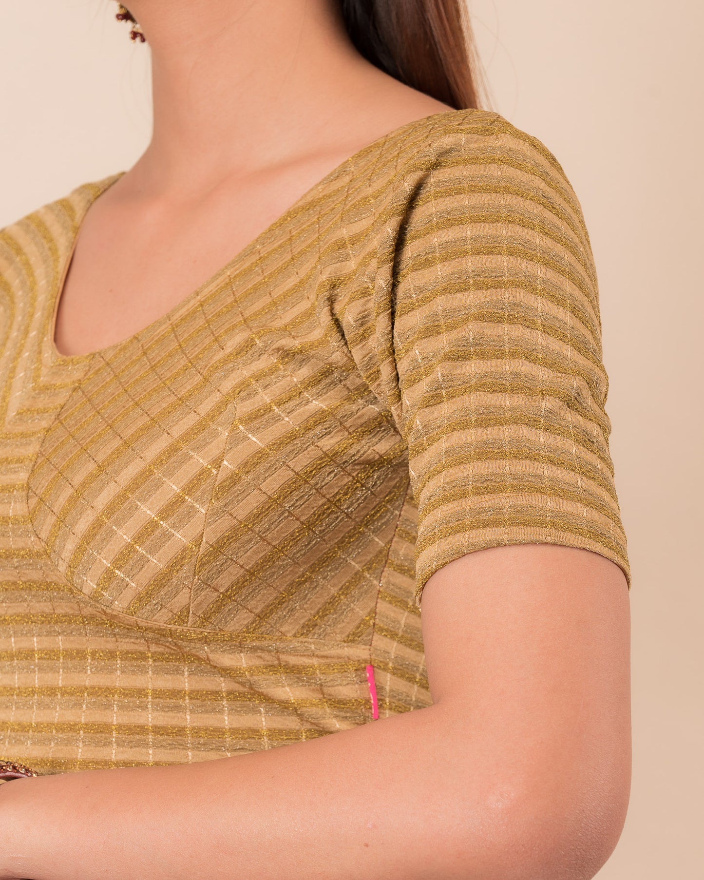 Close-up of the zari stripe fabric detailing the texture and stretchability of the readymade blouse