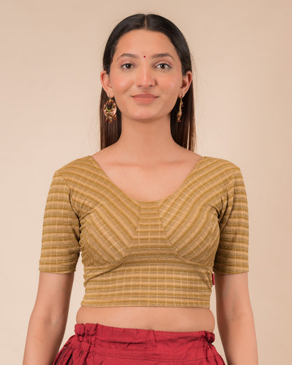 Model wearing a zari stripe stretchable readymade blouse with elbow sleeves and round neckline