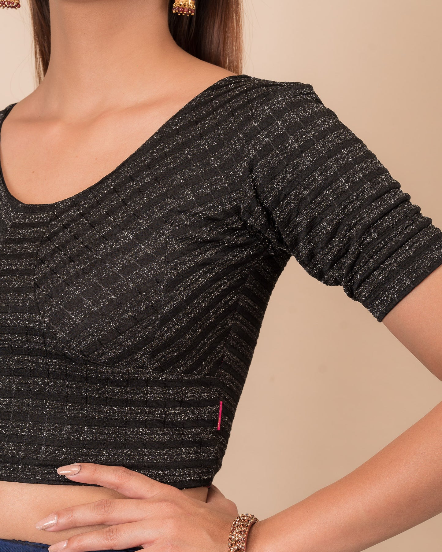 Close-up of the zari stripe fabric detailing the texture and stretchability of the readymade blouse