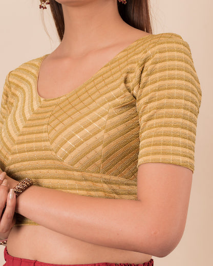 Close-up of the gold  zari stripe fabric detailing the texture and stretchability of the readymade blouse