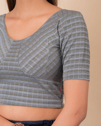 Close-up of the zari stripe fabric detailing the texture and stretchability of the readymade blouse