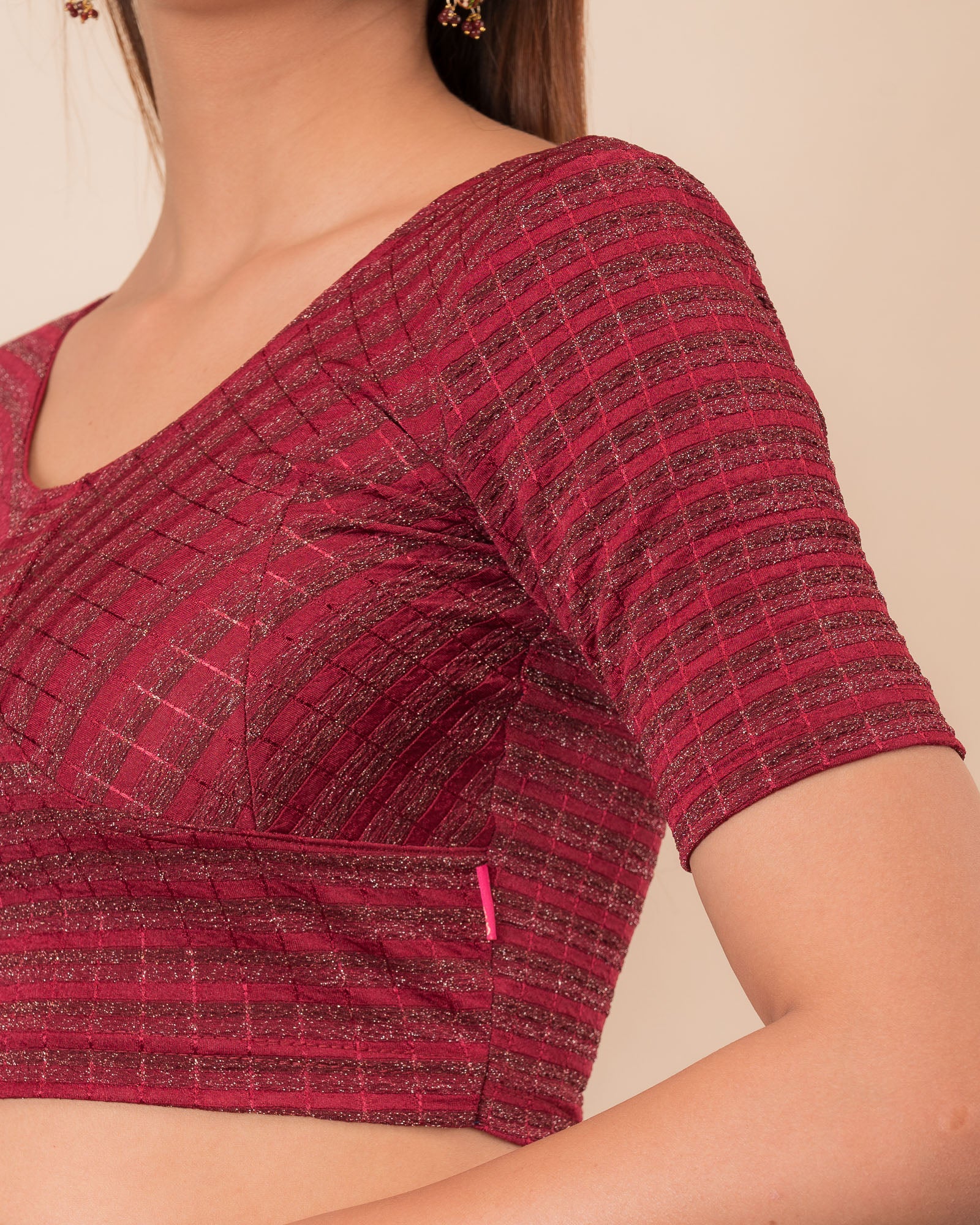 Close-up of the zari stripe fabric detailing the texture and stretchability of the readymade blouse