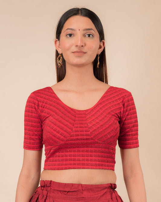 Model wearing a zari stripe stretchable readymade blouse with elbow sleeves and round neckline