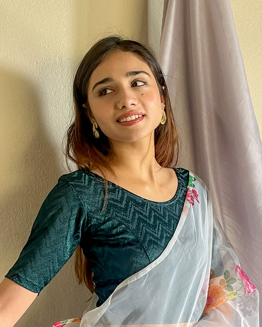 Model pairing the maroon melange zig-zag blouse with a traditional saree, demonstrating a complete ethnic look