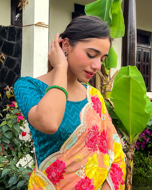 Model pairing the maroon melange zig-zag blouse with a traditional saree, demonstrating a complete ethnic look