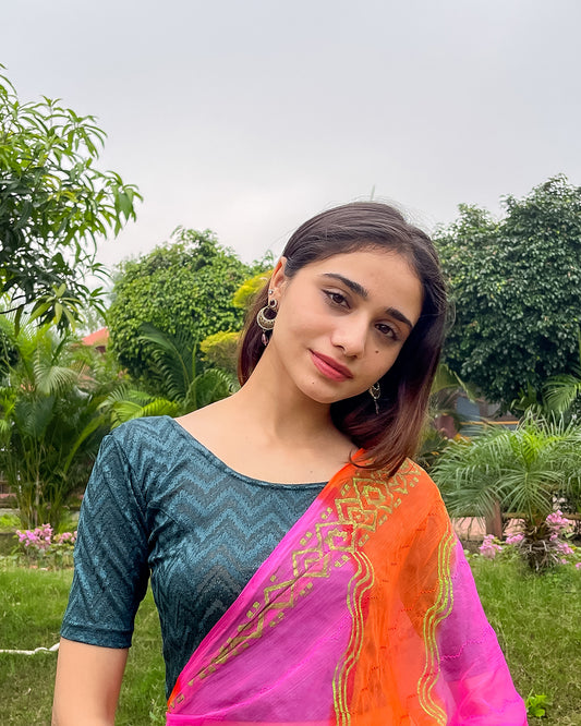 Model pairing the maroon melange zig-zag blouse with a traditional saree, demonstrating a complete ethnic look