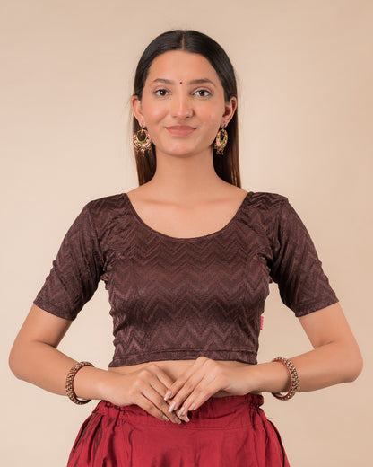 Model wearing a maroon melange zig-zag patterned stretchable readymade blouse with elbow sleeves and round neckline
