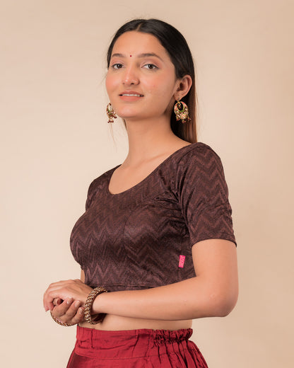 Side profile of the maroon melange zig-zag blouse highlighting the fit and sleeve length
