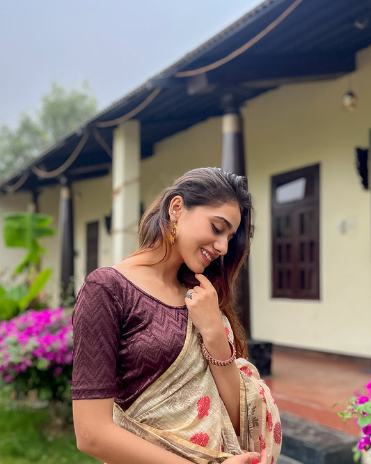 Model pairing the maroon melange zig-zag blouse with a traditional saree, demonstrating a complete ethnic loo
