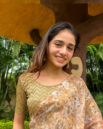 Model pairing the maroon melange zig-zag blouse with a traditional saree, demonstrating a complete ethnic look