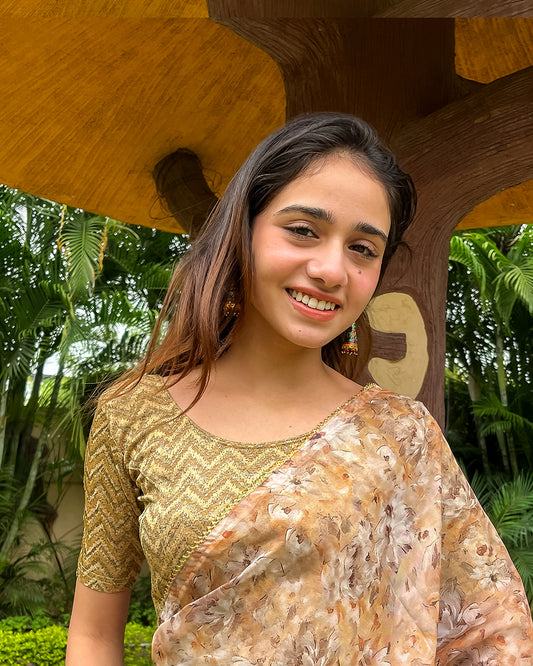 Model pairing the maroon melange zig-zag blouse with a traditional saree, demonstrating a complete ethnic look