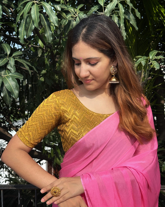 Model pairing the maroon melange zig-zag blouse with a traditional saree, demonstrating a complete ethnic look