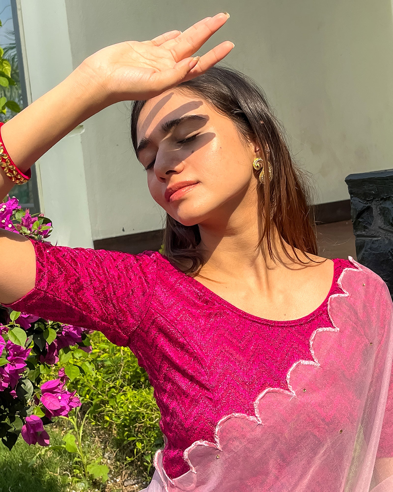 Model pairing the maroon melange zig-zag blouse with a traditional saree, demonstrating a complete ethnic look