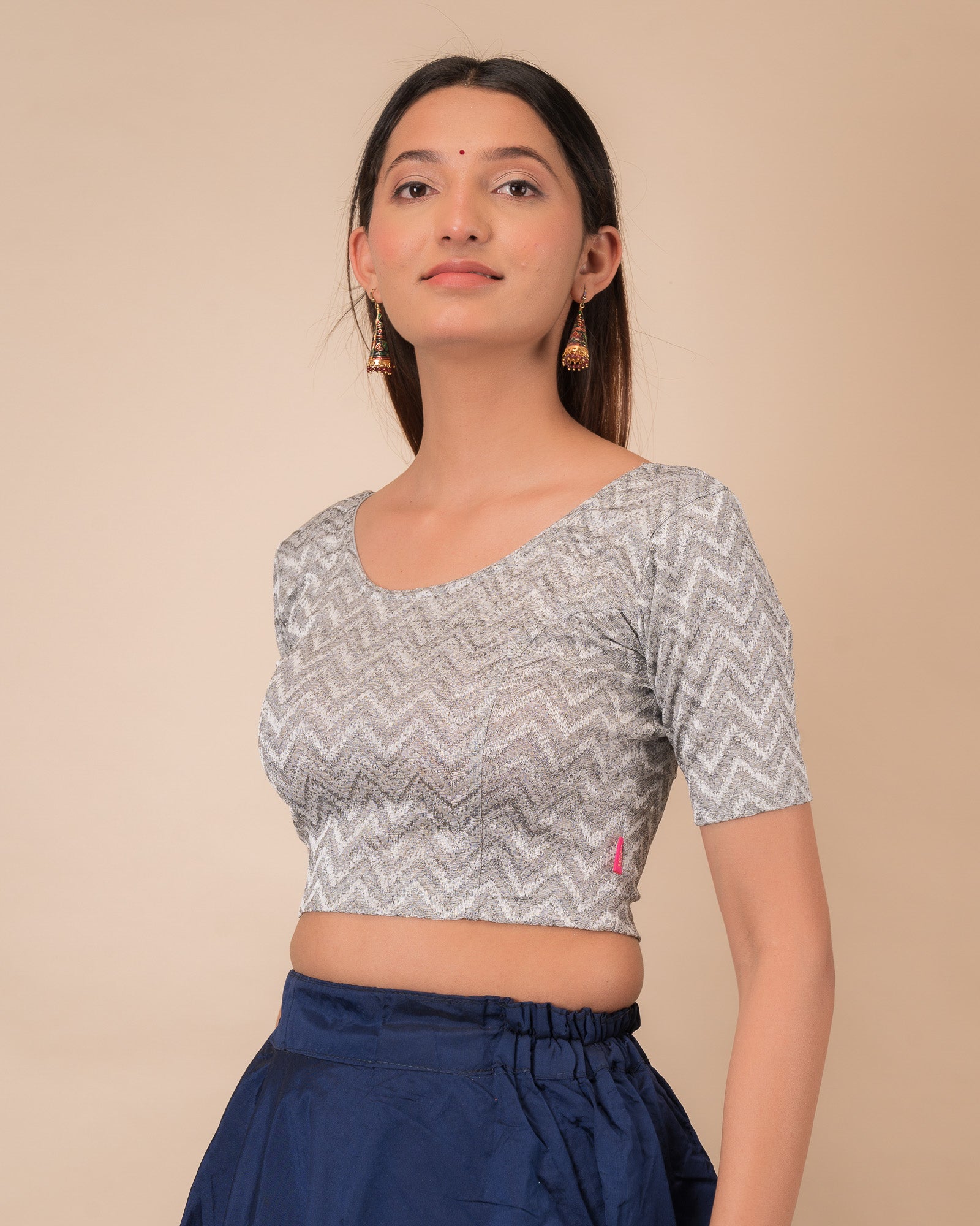 Side profile of the maroon melange zig-zag blouse highlighting the fit and sleeve length