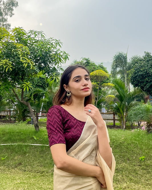 Model pairing the maroon melange zig-zag blouse with a traditional saree, demonstrating a complete ethnic look
