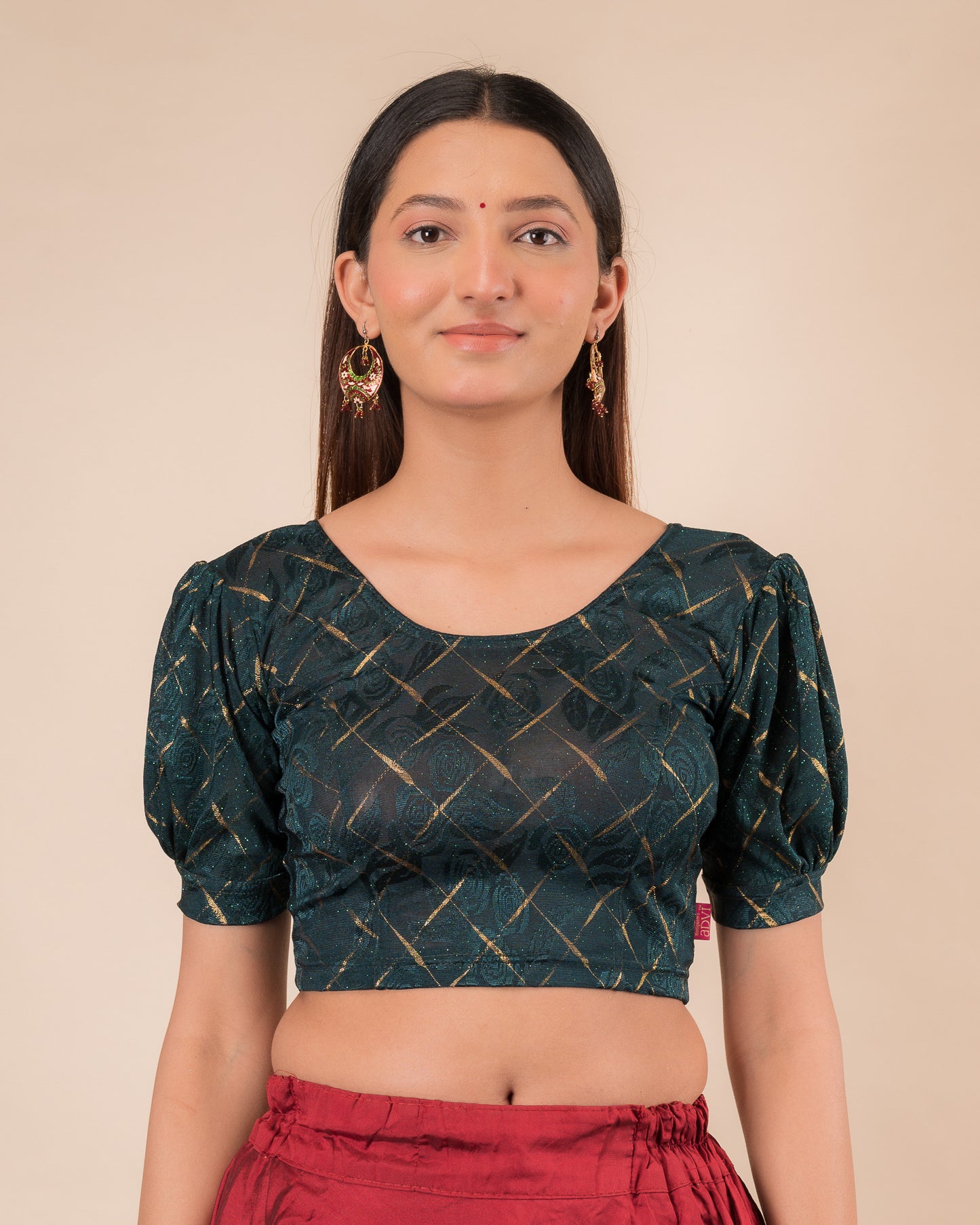  Model wearing a grey melange stretchable readymade blouse with puffed elbow sleeves and round neckline