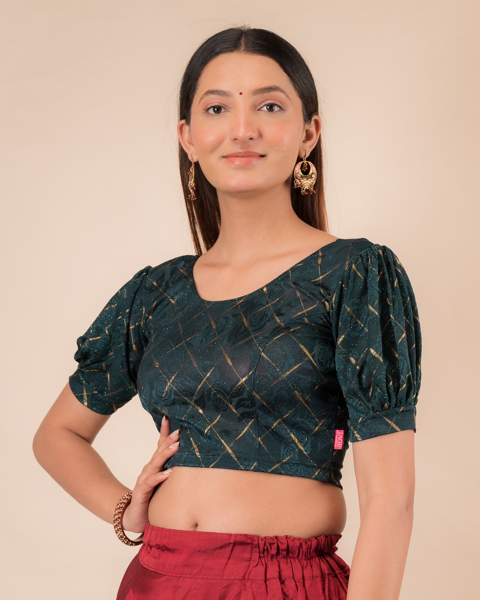 Side profile of the grey melange stretchable blouse highlighting the fit and sleeve length