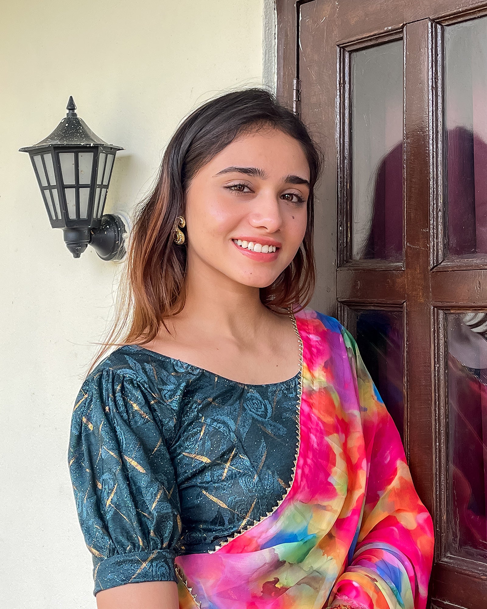 Model pairing the grey melange stretchable blouse with a traditional saree, demonstrating a complete ethnic look
