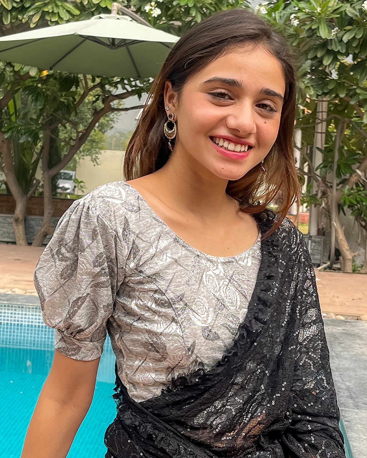 Model pairing the grey melange stretchable blouse with a traditional saree, demonstrating a complete ethnic look