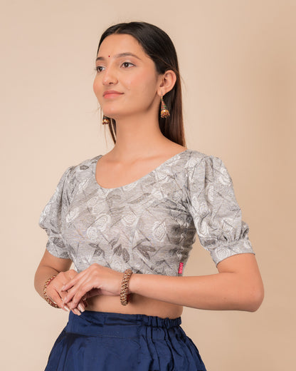 Side profile of the grey melange stretchable blouse highlighting the fit and sleeve length