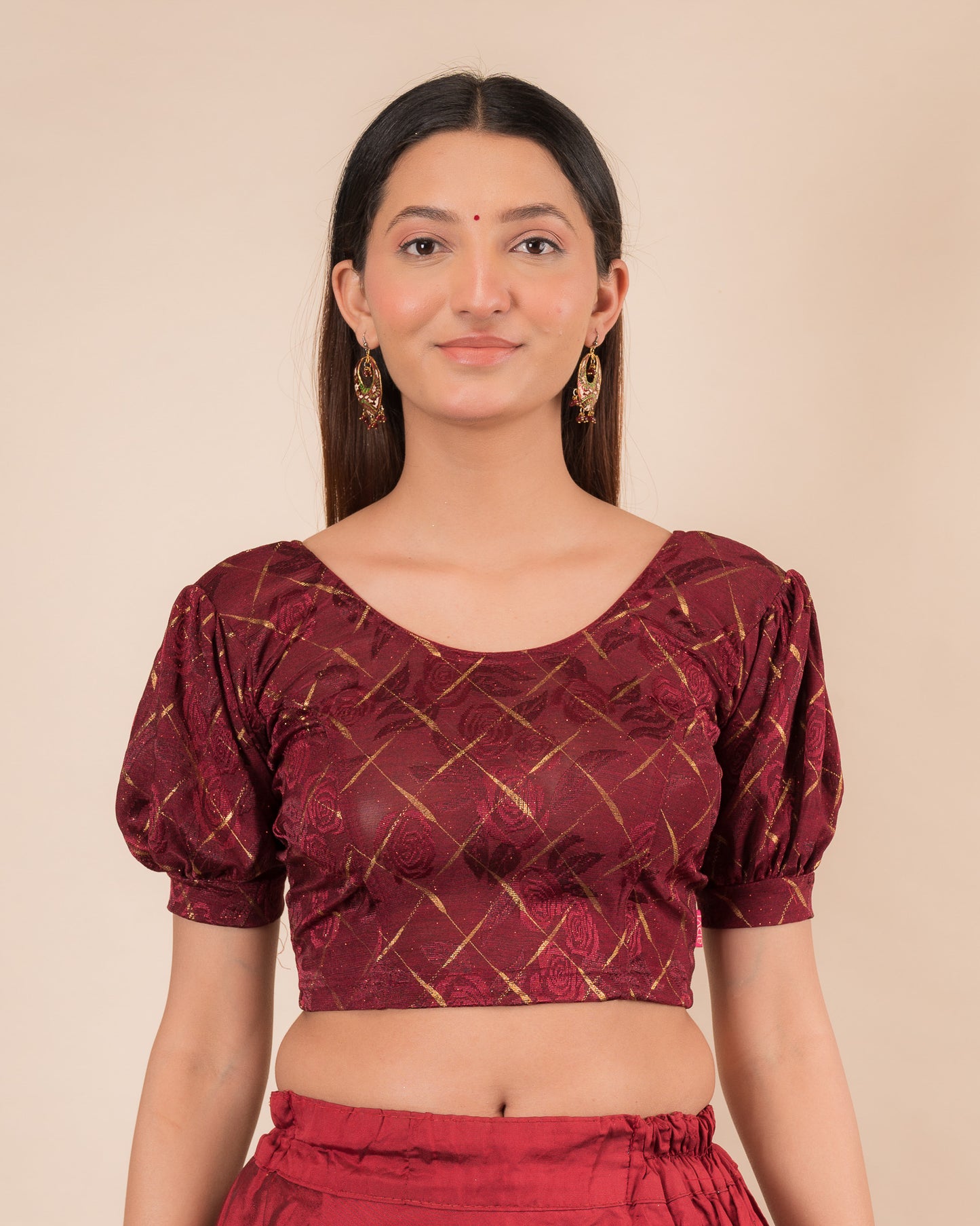 Model wearing a grey melange stretchable readymade blouse with puffed elbow sleeves and round neckline