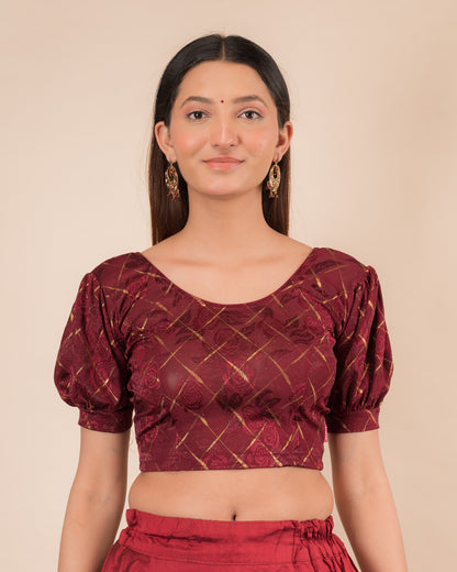 Model wearing a grey melange stretchable readymade blouse with puffed elbow sleeves and round neckline