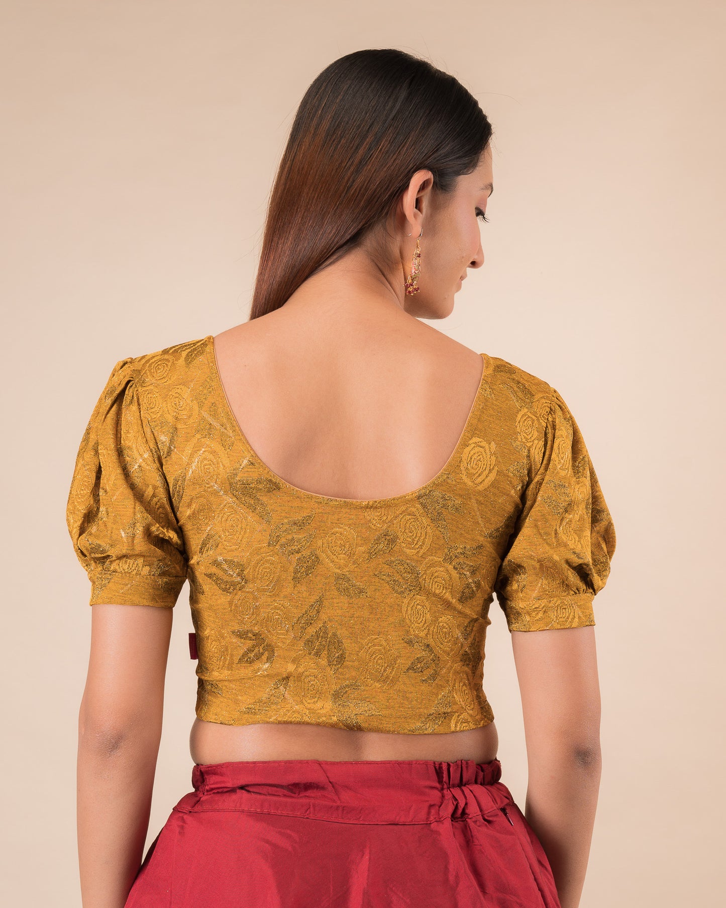 Rear view of the grey melange stretchable blouse showcasing the back design
