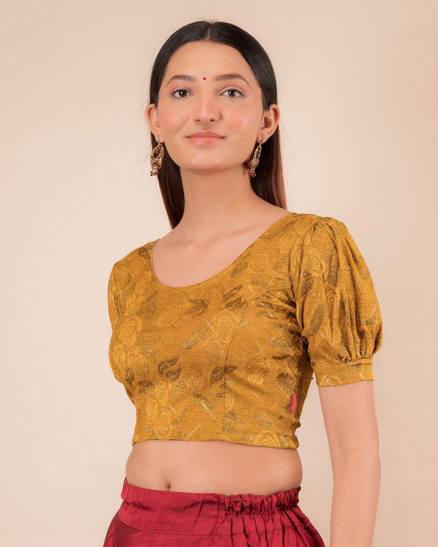  Side profile of the grey melange stretchable blouse highlighting the fit and sleeve length