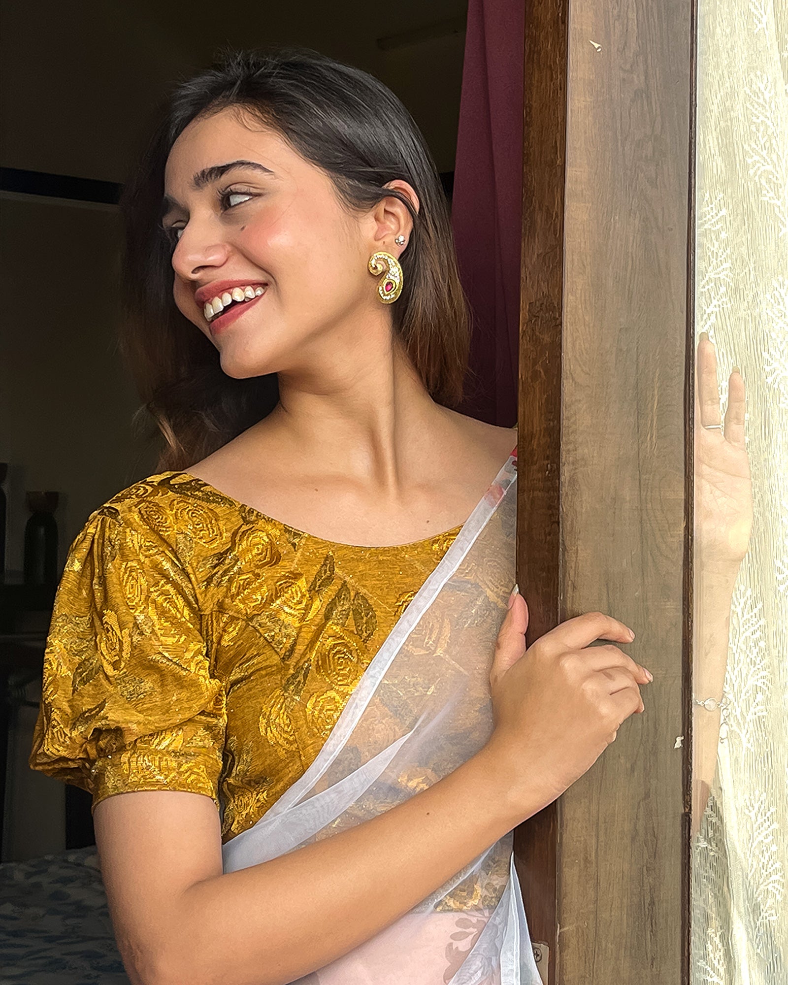Model pairing the grey melange stretchable blouse with a traditional saree, demonstrating a complete ethnic look