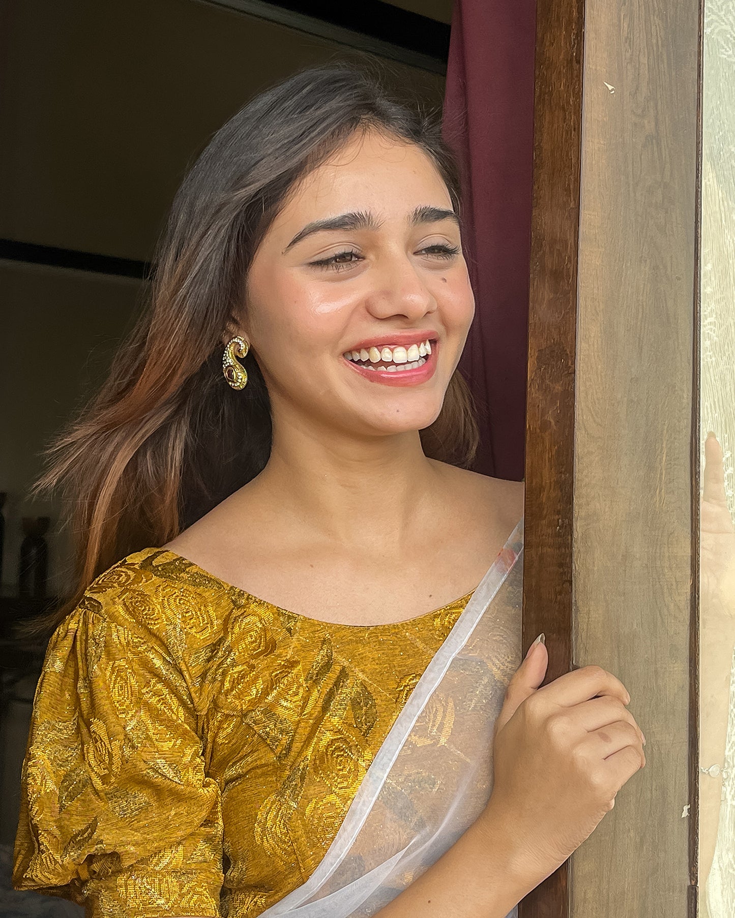 Model pairing the grey melange stretchable blouse with a traditional saree, demonstrating a complete ethnic look