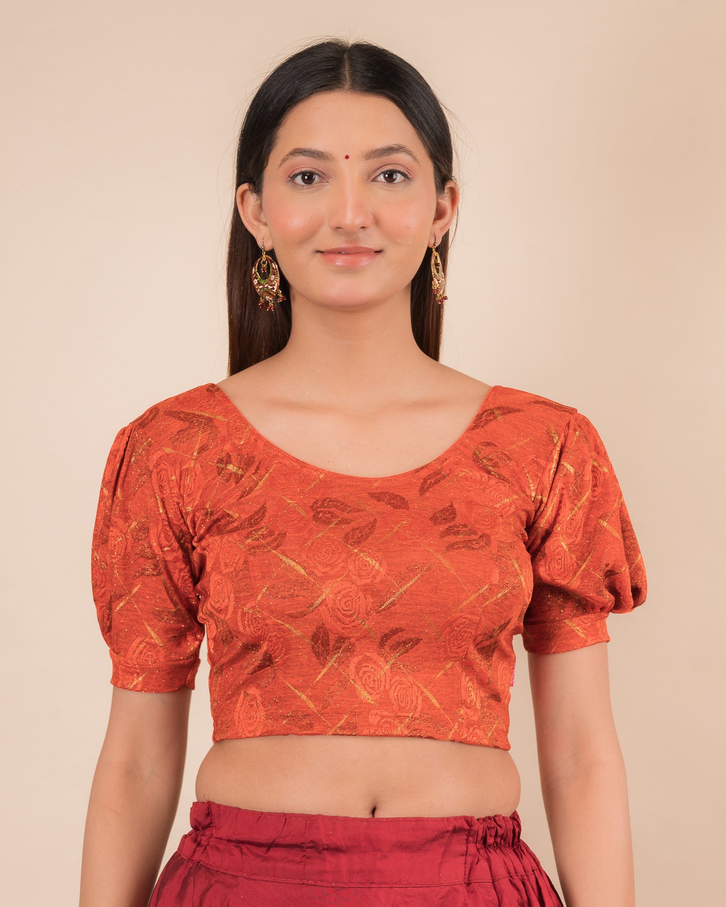 Model wearing a grey melange stretchable readymade blouse with puffed elbow sleeves and round neckline