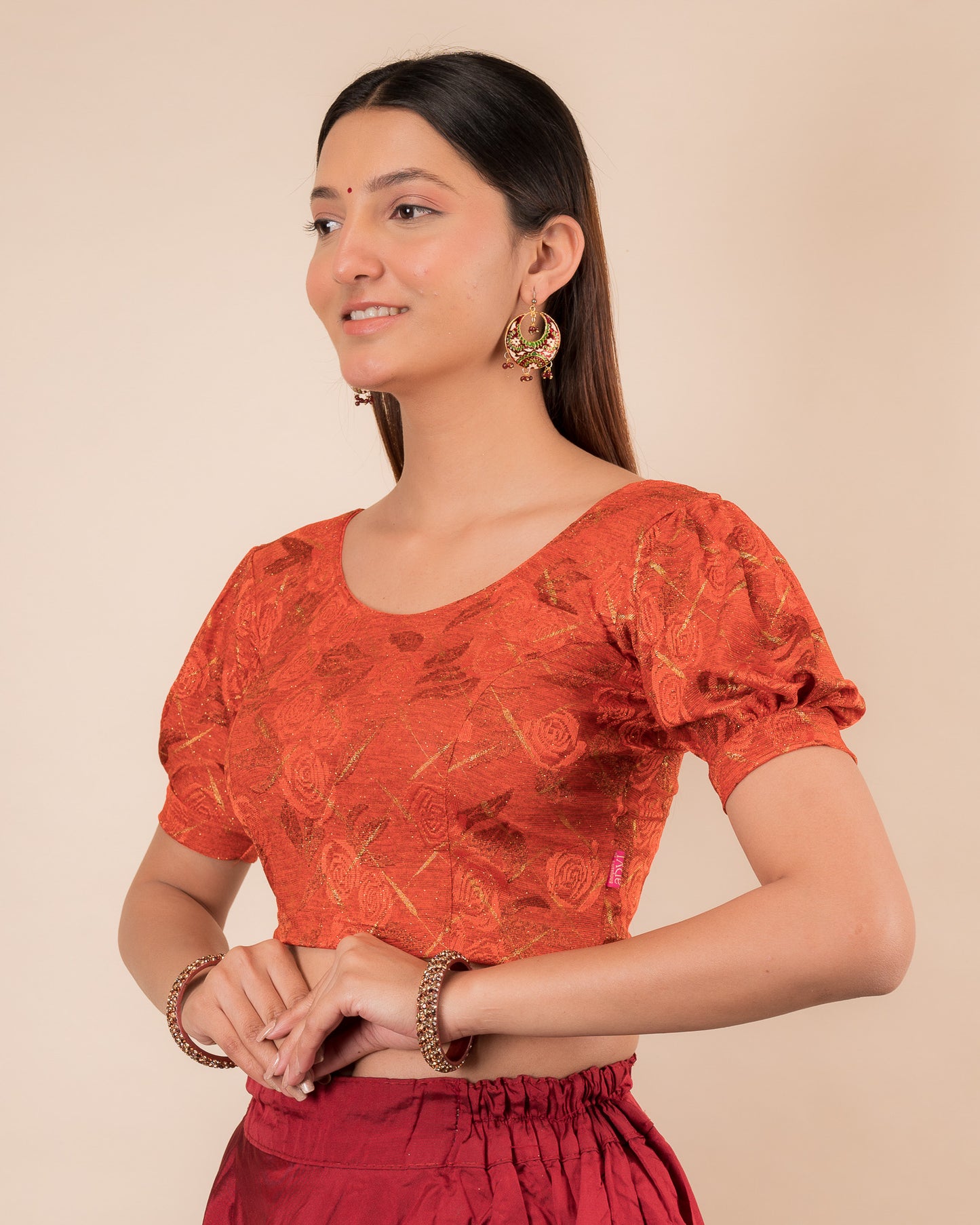  Side profile of the grey melange stretchable blouse highlighting the fit and sleeve length