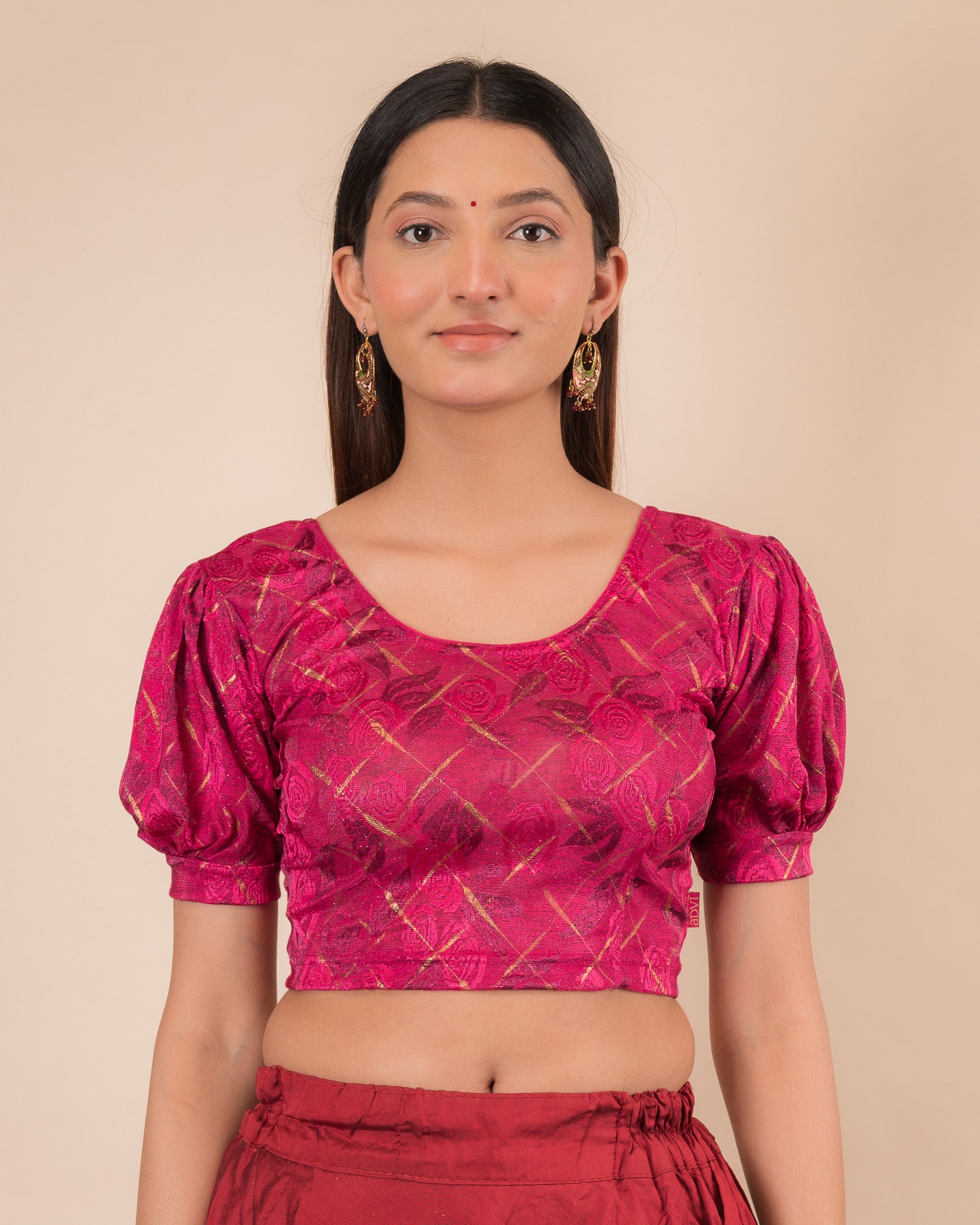 Model wearing a grey melange stretchable readymade blouse with puffed elbow sleeves and round neckline