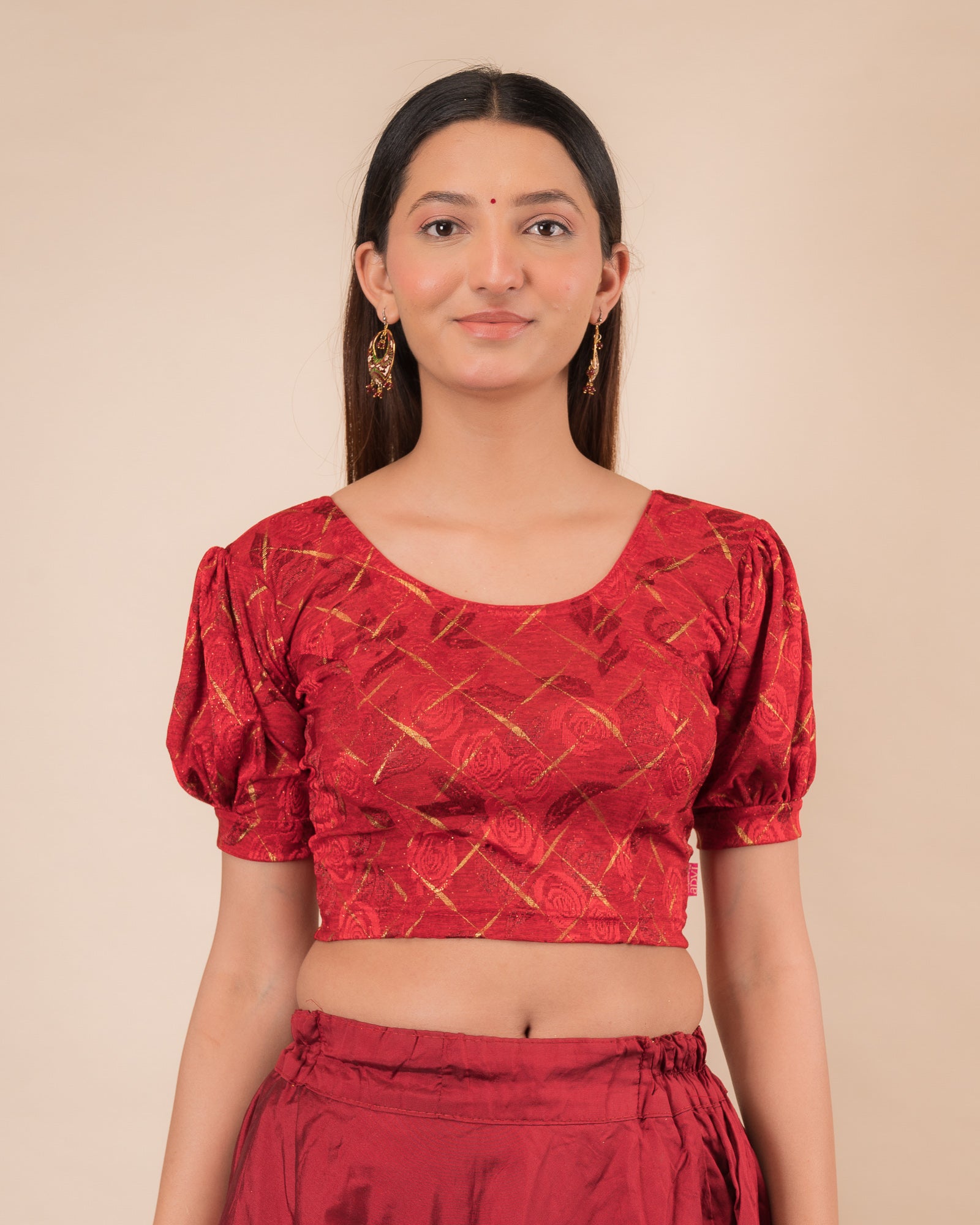 Model wearing a grey melange stretchable readymade blouse with puffed elbow sleeves and round neckline