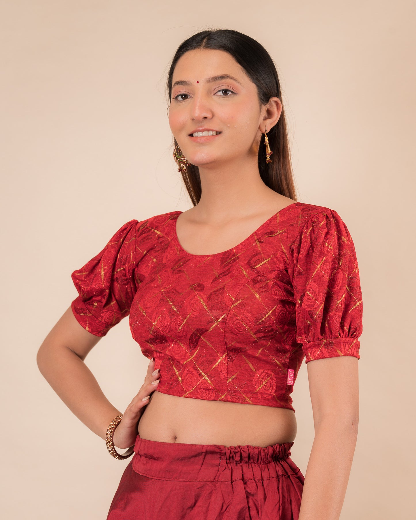 Model wearing a grey melange stretchable readymade blouse with puffed elbow sleeves and round neckline