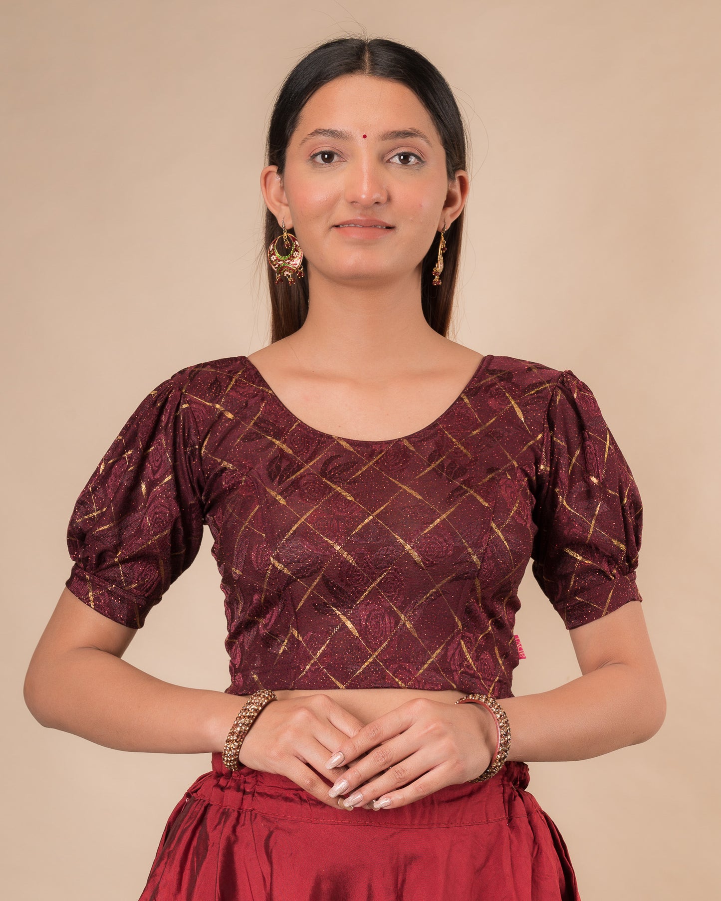 Model wearing a grey melange stretchable readymade blouse with puffed elbow sleeves and round neckline