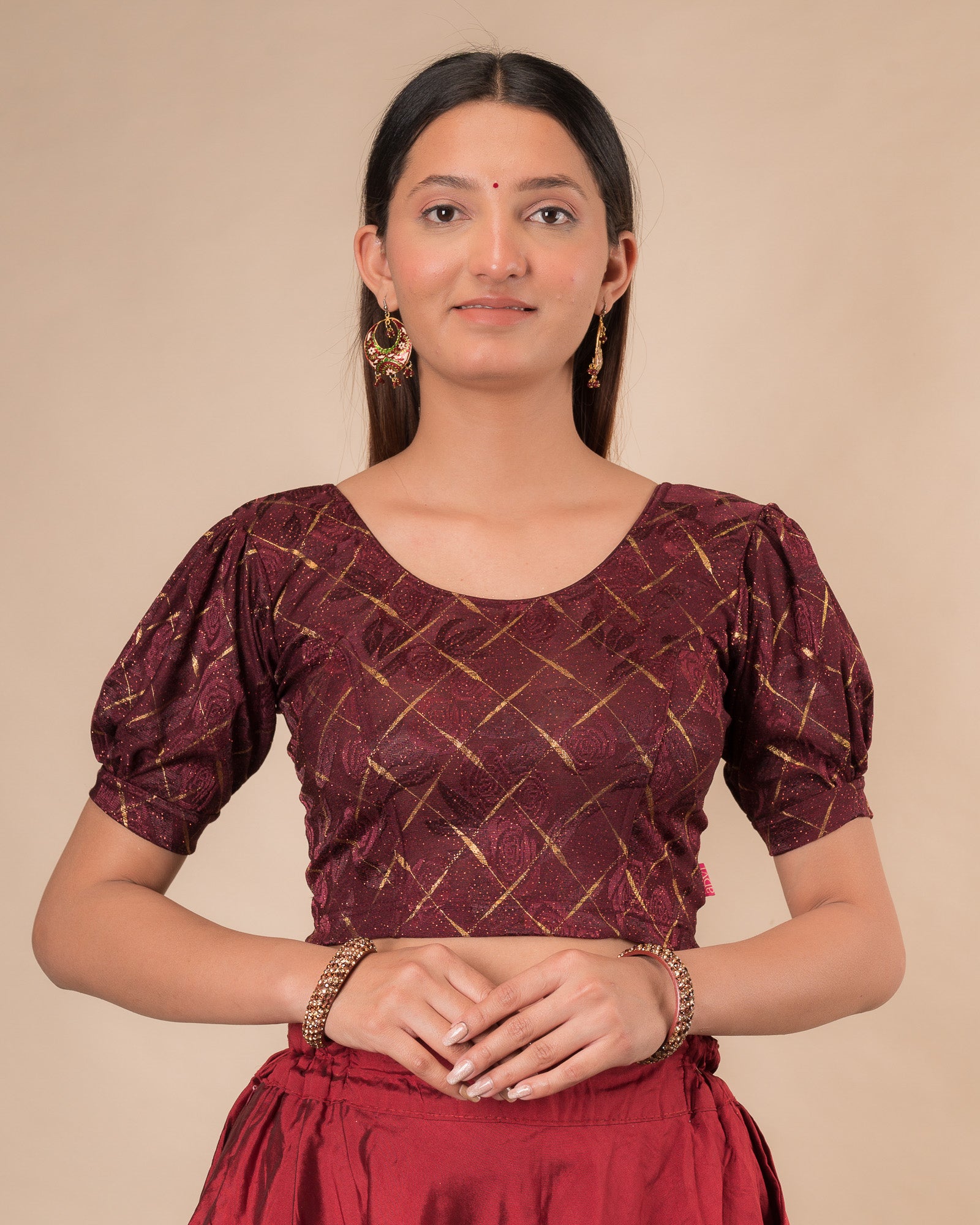 Model wearing a grey melange stretchable readymade blouse with puffed elbow sleeves and round neckline