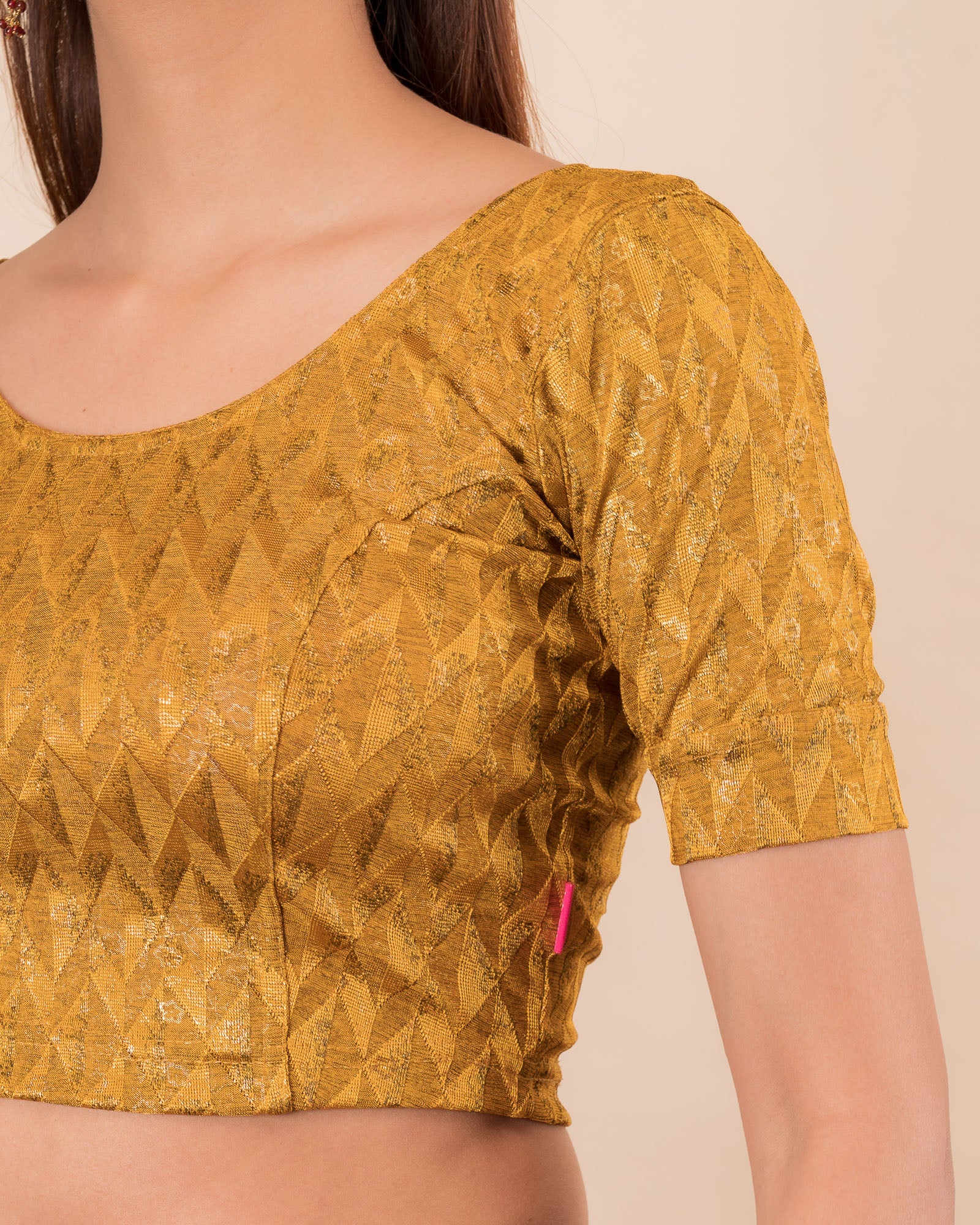 Close-up of the melange jacquard fabric with metallic foil and texture