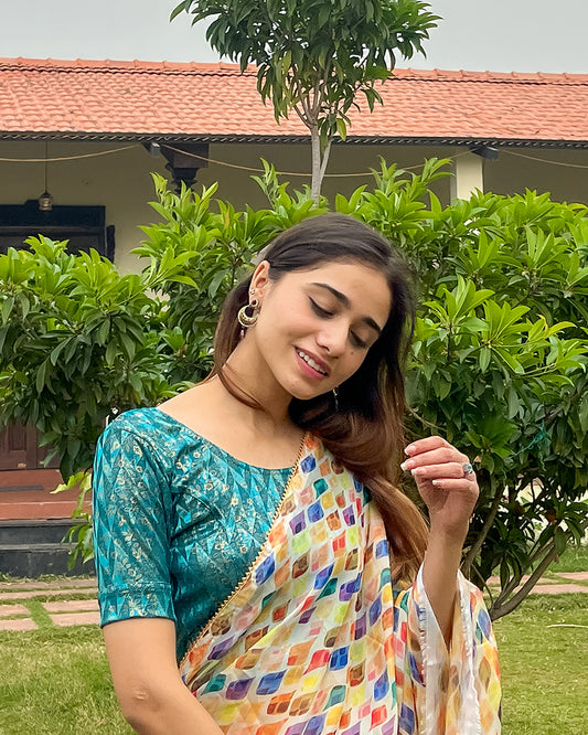 Model pairing the blouse with a saree for festive look