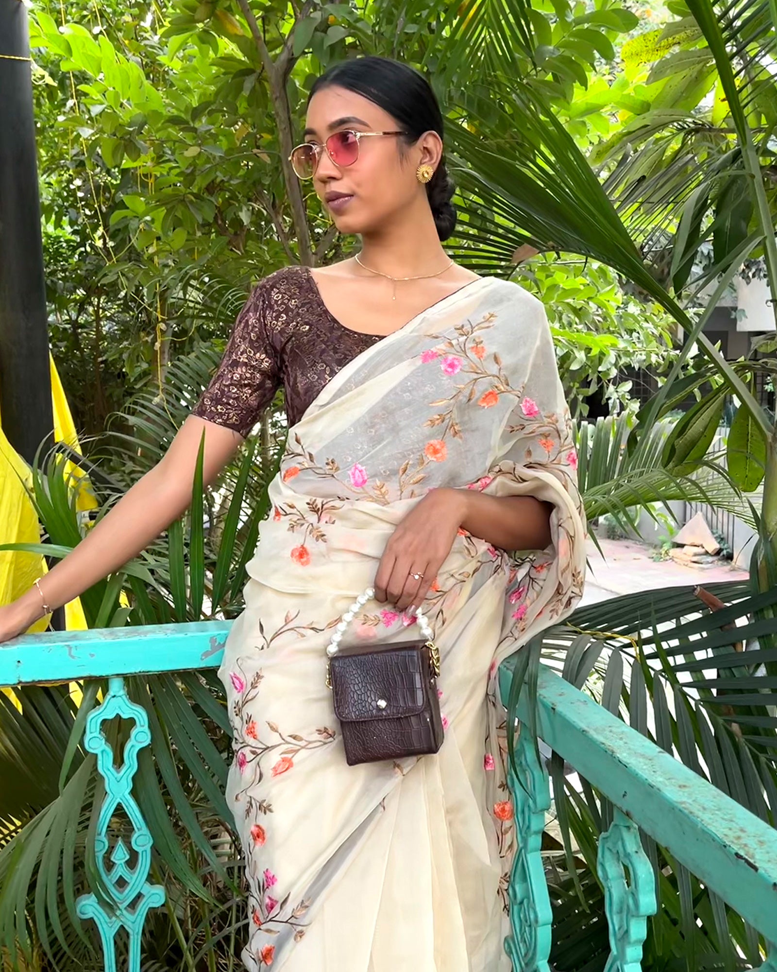Model pairing the blouse with a saree for festive look