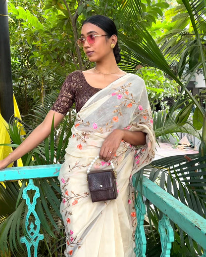 Model pairing the blouse with a saree for festive look