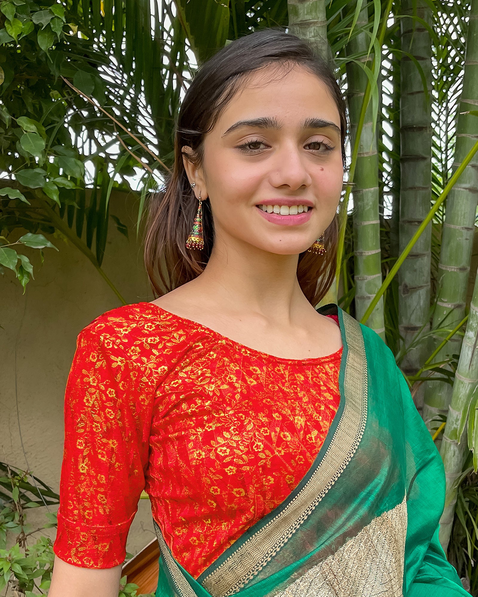 Model pairing the blouse with a saree for festive look