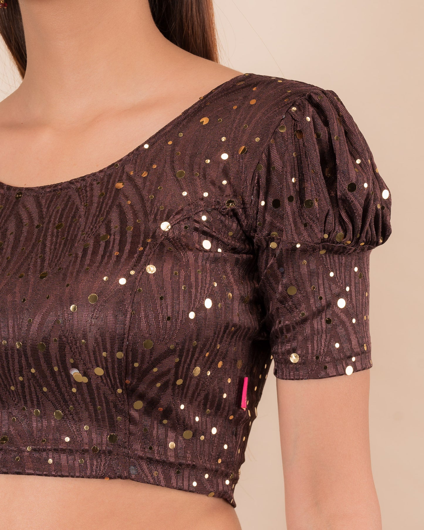 Close-up showing mirror embellishments on the jacquard stretchable fabric