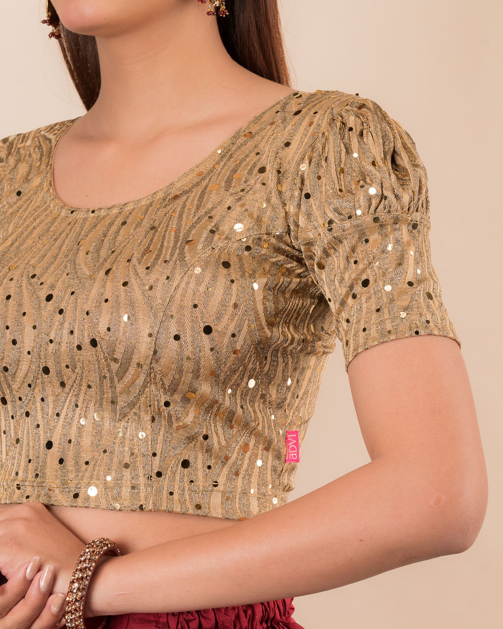 Close-up showing mirror embellishments on the jacquard stretchable fabric