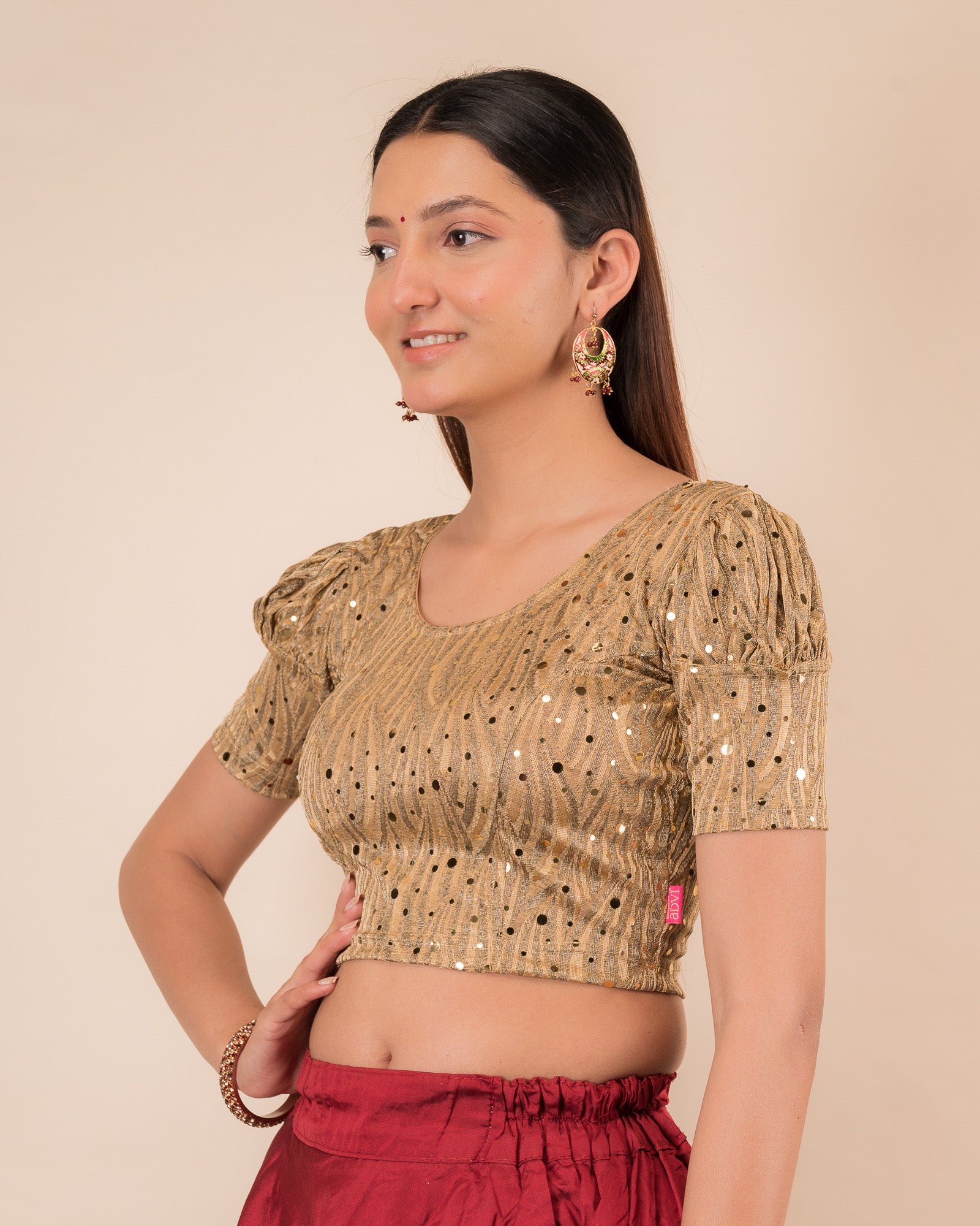 Side profile highlighting the fit and puffed sleeve silhouette