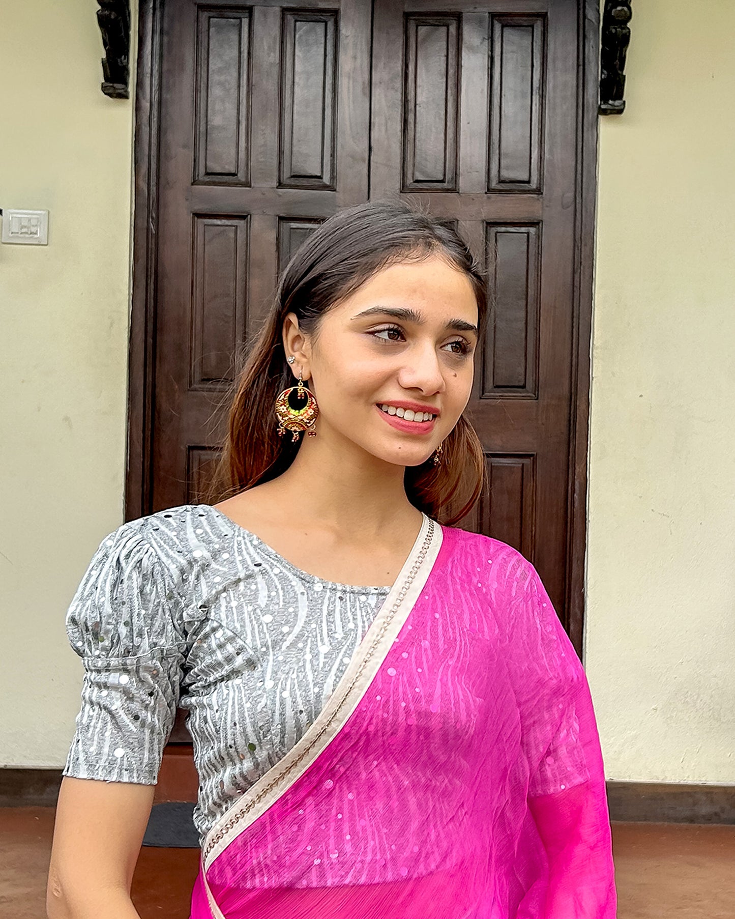 Model pairing the blouse with a saree for a festive occasion