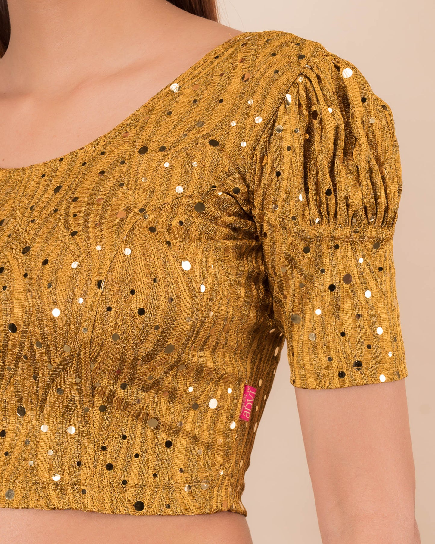 Close-up showing mirror embellishments on the jacquard stretchable fabric