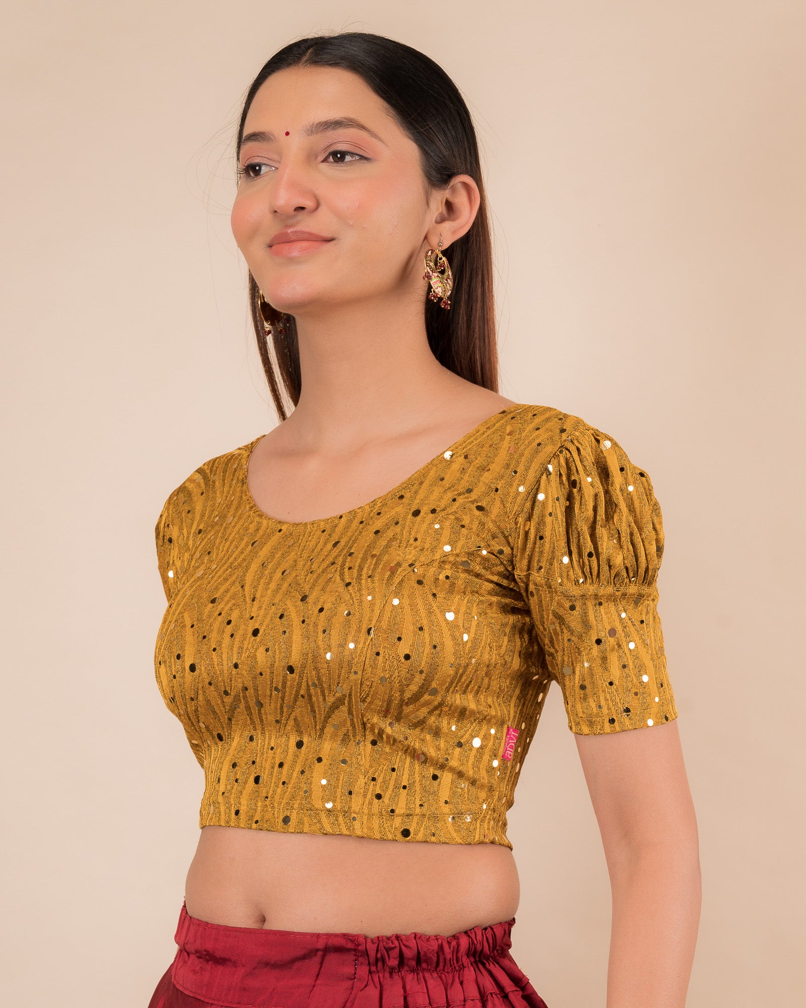 Side profile highlighting the fit and puffed sleeve silhouette