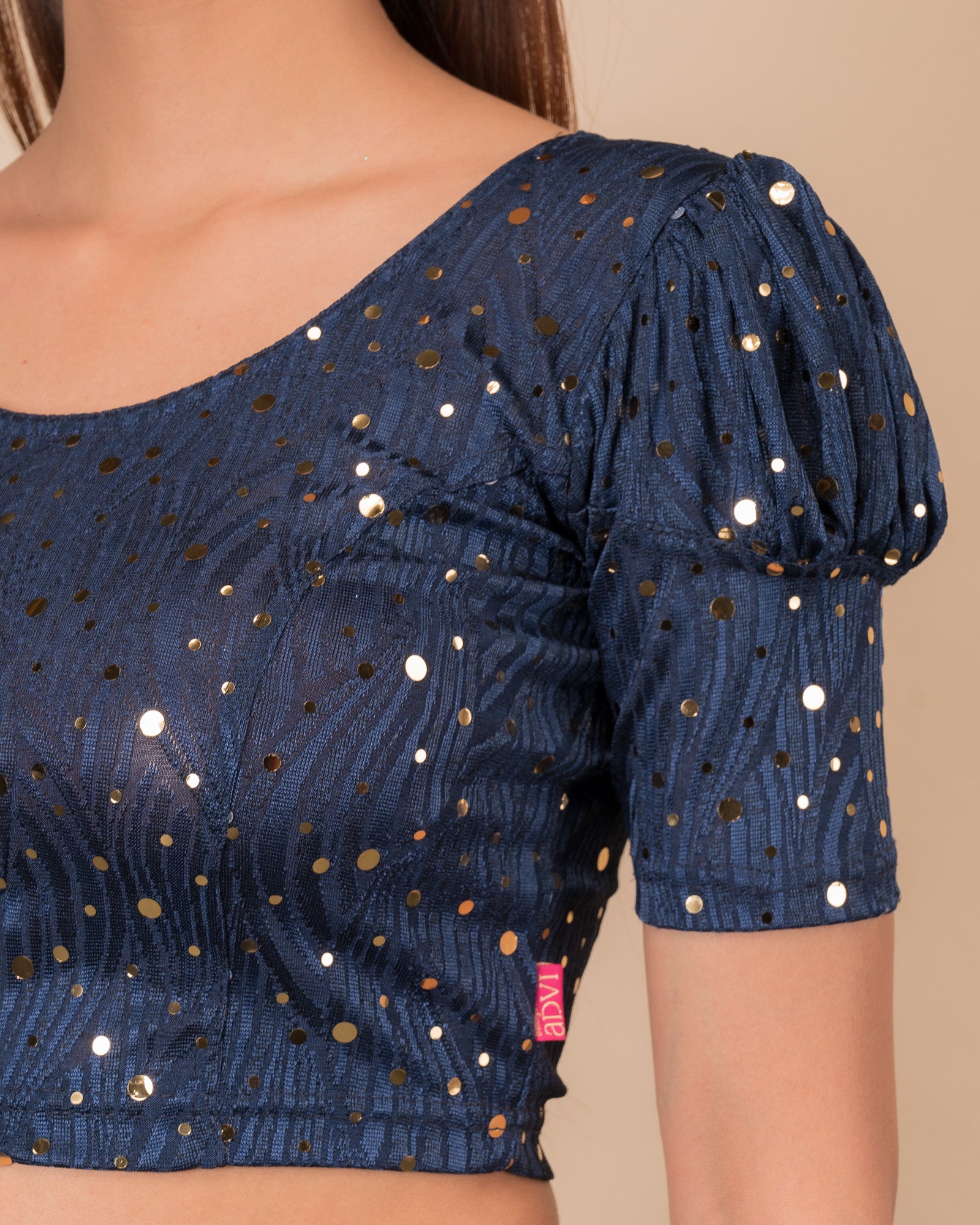 Close-up showing mirror embellishments on the jacquard stretchable fabric.